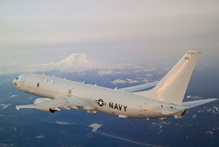 p-8a in flight over Washington State with Mt Rainier in the background.